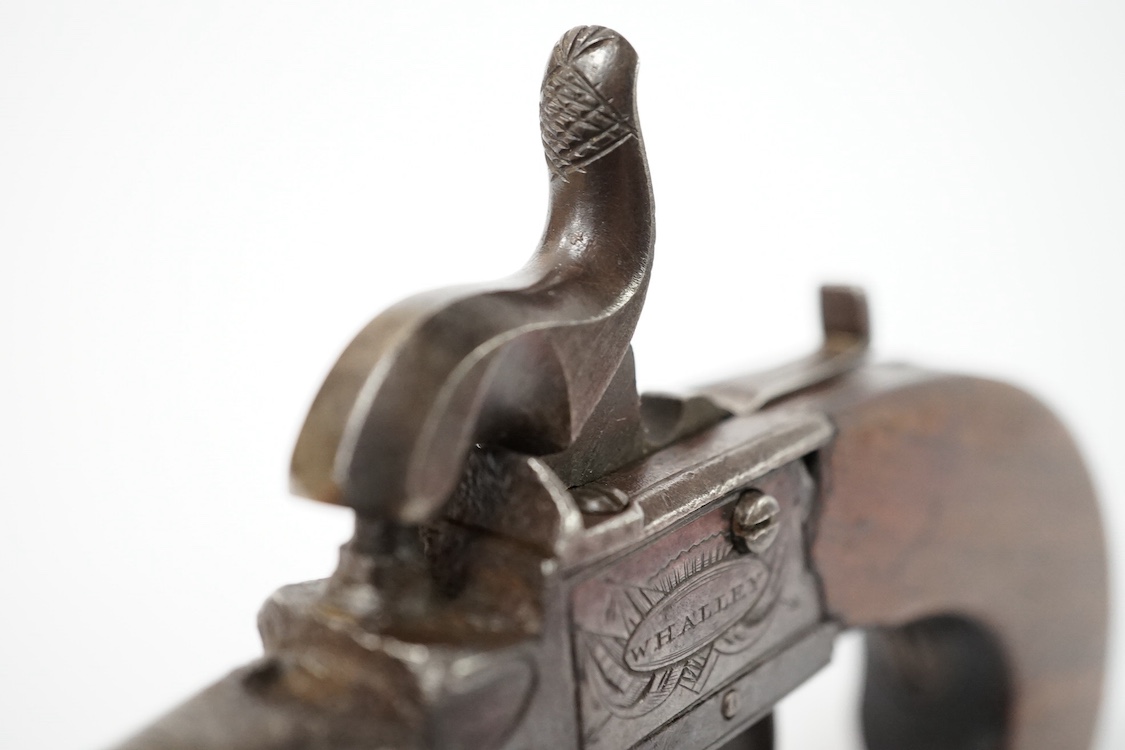 A boxlock percussion pocket pistol, London proved, with turn off barrel, frame signed Whalley within oval upon flag trophy, sliding top thumb safety, slab walnut grip. Condition - fair to good.